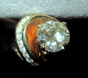 Round Brilliant Center Diamond with Side Channel Set Diamonds